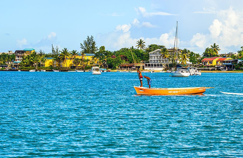 Local men rowing boat on sea in Grand Baie, Mauritius By Phuong D. Nguyen | World Travel Magazine Local men rowing boat on sea in Grand Baie, Mauritius By Phuong D. Nguyen