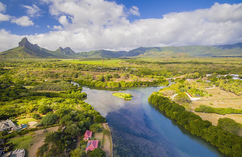 Top down aerial view of Black River Tamarin - Mauritius beach. Curepipe Black River Gorge National Park in background by Quality Master | World Travel Magazine Top down aerial view of Black River Tamarin - Mauritius beach. Curepipe Black River Gorge National Park in background by Quality Master