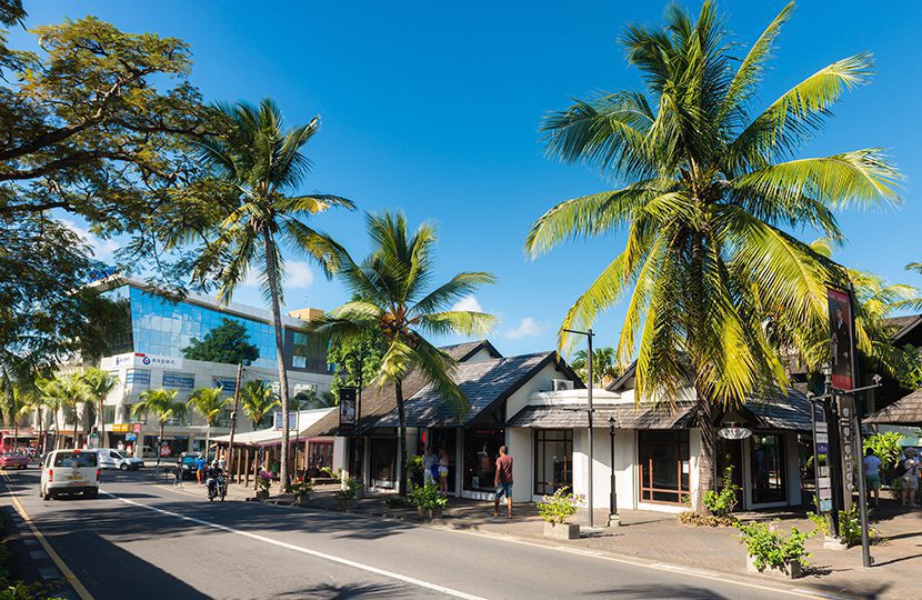Royal Road of seaside city of Grand-Baie in Mauritius Island. Beautiful weather in coastal city of tropical island by Karl Ahnee | World Travel Magazine Royal Road of seaside city of Grand-Baie in Mauritius Island. Beautiful weather in coastal city of tropical island by Karl Ahnee