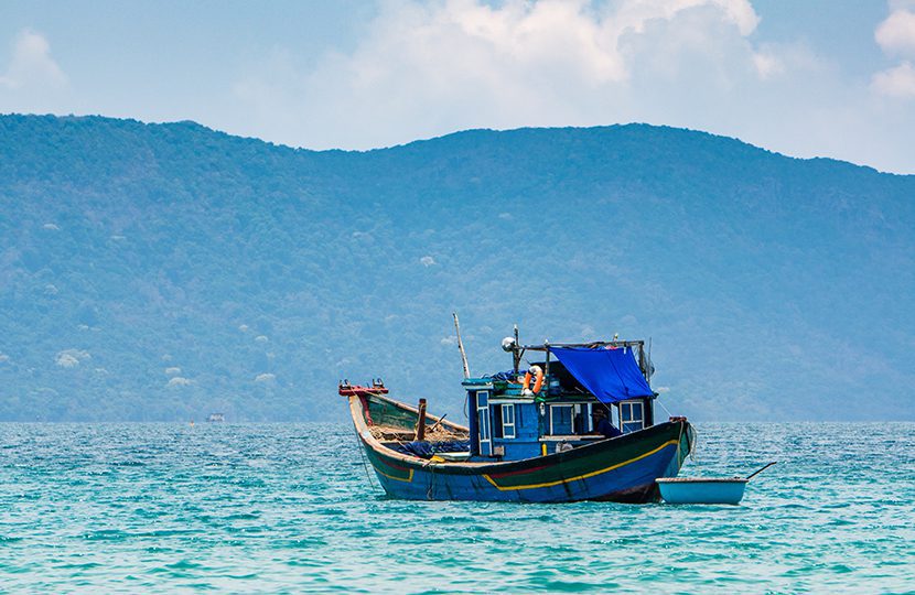 Boats and tropical beach, Con Dao island, Con Son bay by Tonkinphotography | World Travel Magazine Boats and tropical beach, Con Dao island, Con Son bay by Tonkinphotography