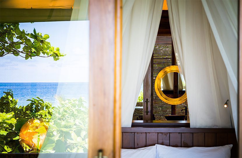 Room's bath area plays hide and seek amongst drapes | World Travel Magazine Room's bath area plays hide and seek amongst drapes