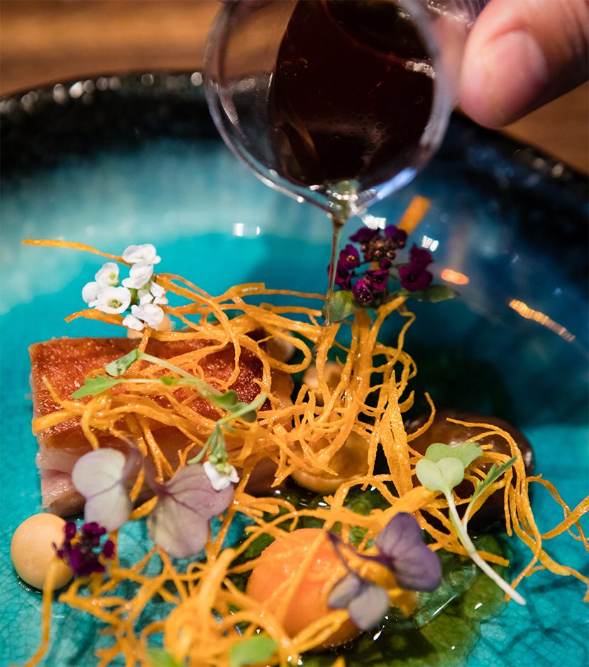 The Test Kitchen - Crisp Pork Belly, Wood Roasted Sweet Potato, Orange Dashi | World Travel Magazine