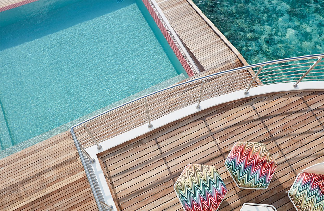 Lux North Male Atoll - Colourful umbrellas adds exciting hues to the blue-and-wood backdrop | World Travel Magazine Lux North Male Atoll - Colourful umbrellas adds exciting hues to the blue-and-wood backdrop
