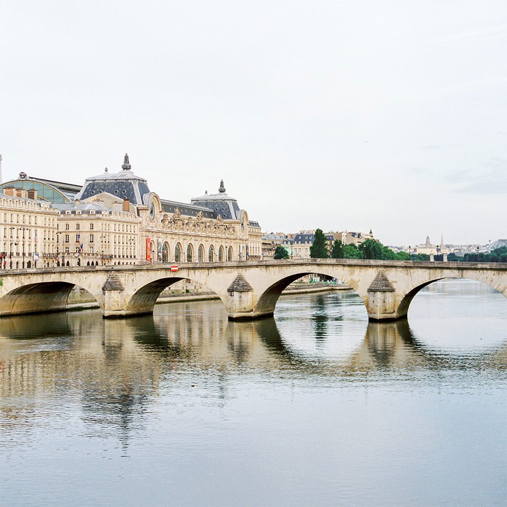 Bronze lions stand guard at the entrance to the Louvre, photo by Analui | World Travel Magazine Bronze lions stand guard at the entrance to the Louvre, photo by Analui