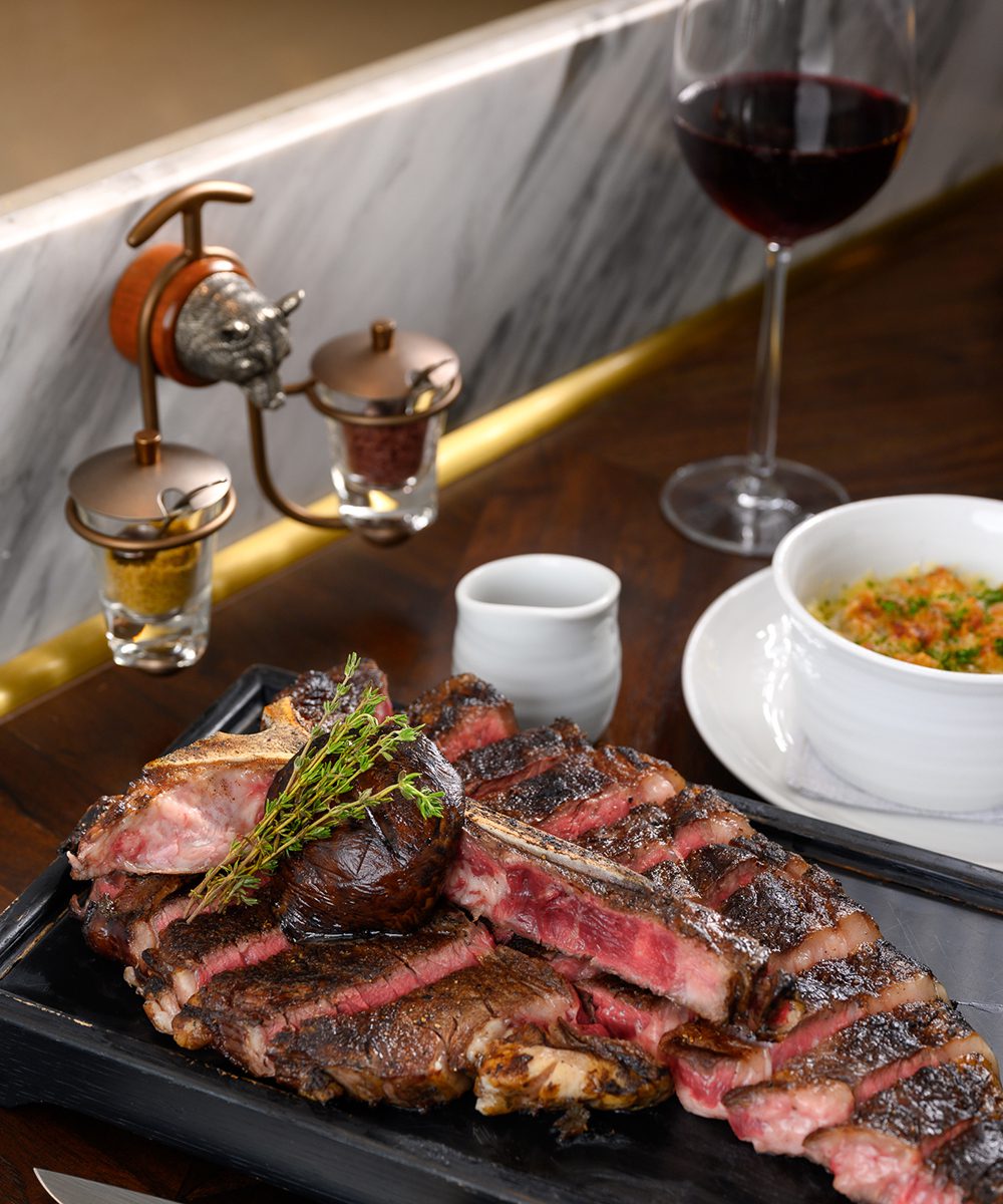 Steak with Mac and Cheese at Bull Bear | World Travel Magazine Steak with Mac and Cheese at Bull Bear