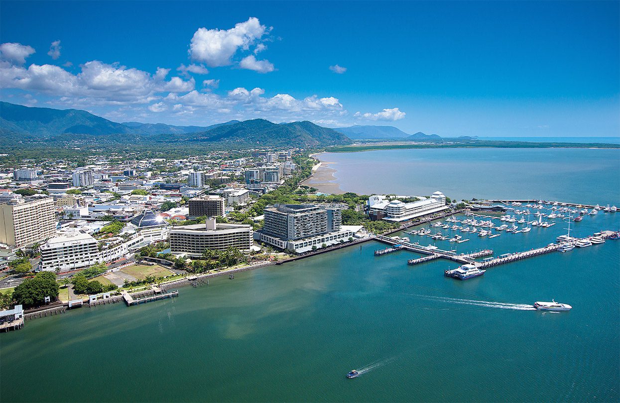 The city of Cairns hugs the coast of Tropical North Queensland, photo by Tourism & Events Queensland | World Travel Magazine The city of Cairns hugs the coast of Tropical North Queensland, photo by Tourism & Events Queensland