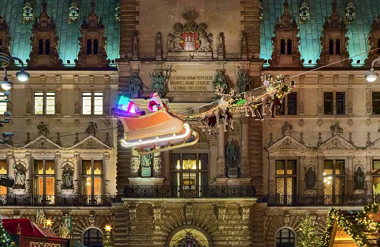 Flying Santa Claus in front of Hamburg Town Hall, image by Mikhail Markovskiy, Shutterstock | World Travel Magazine Flying Santa Claus in front of Hamburg Town Hall, image by Mikhail Markovskiy, Shutterstock