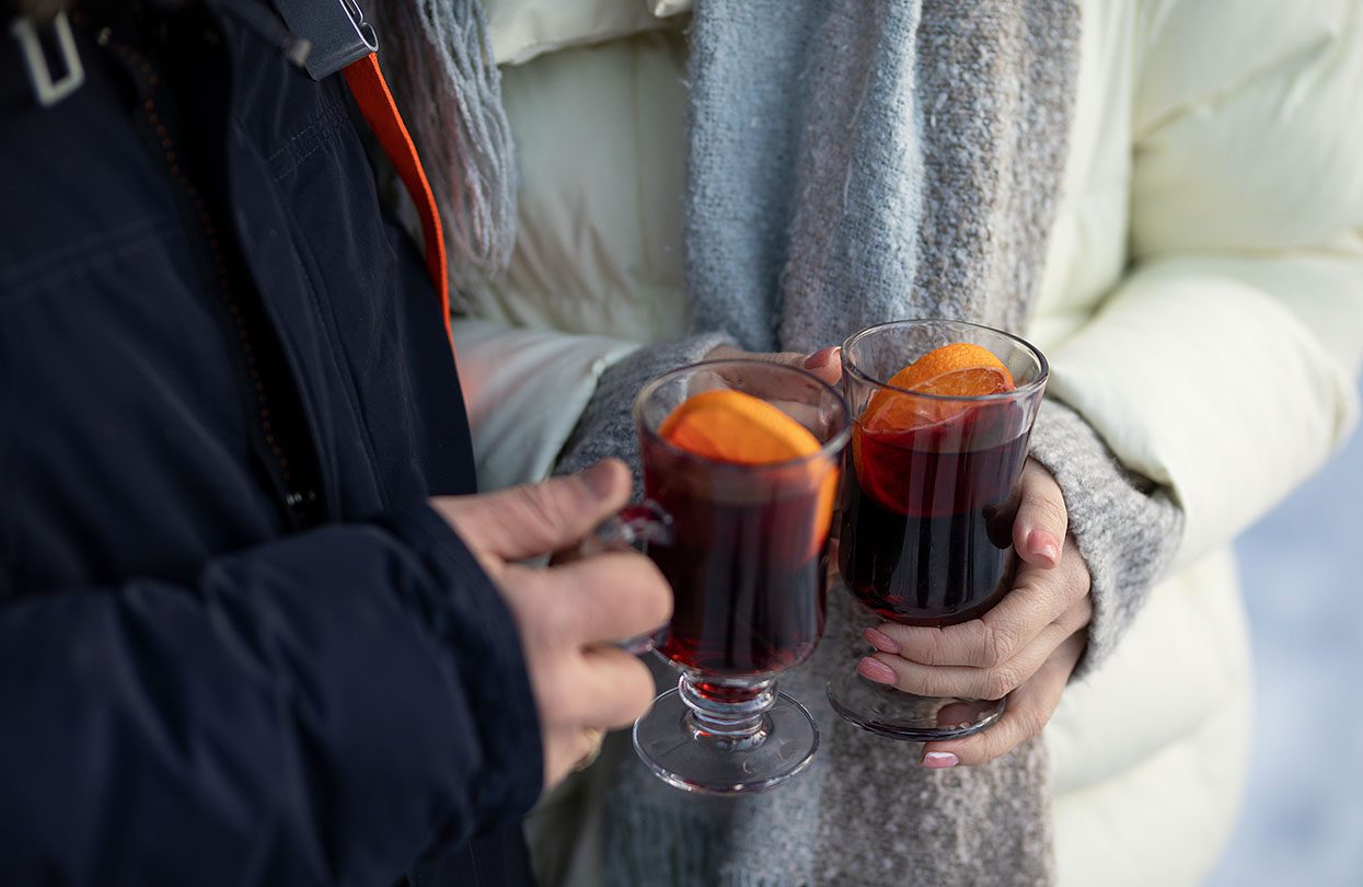 Enjoying glasses of mulled wine in Hamburg, image by Natalya Biryukova, Shutterstock | World Travel Magazine Enjoying glasses of mulled wine in Hamburg, image by Natalya Biryukova, Shutterstock